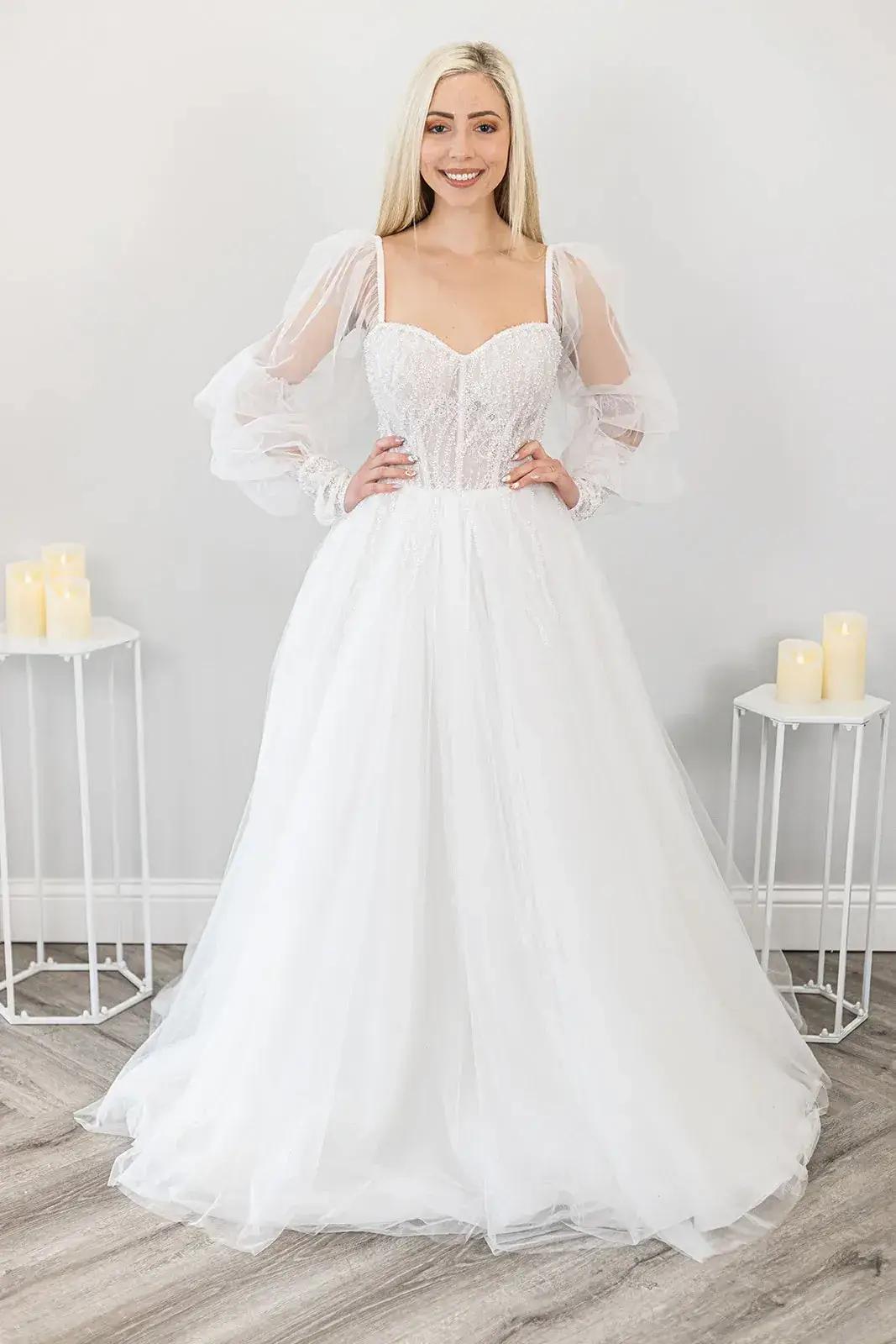 Sleeves or Bare Shoulders: Decoding the Bridal Dilemma for a Timeless Wedding Look Image